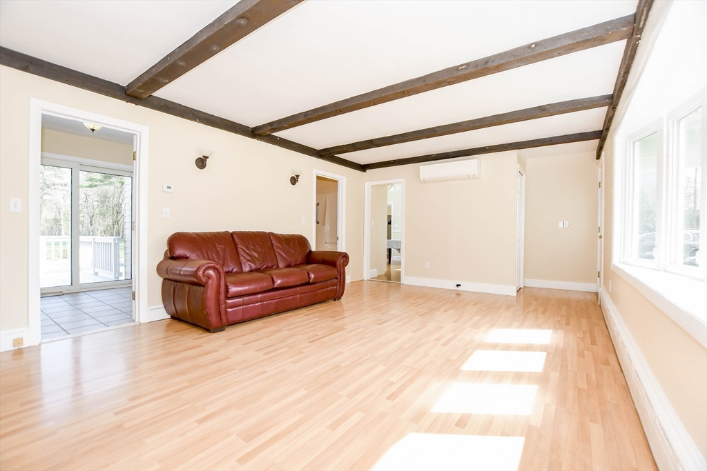 60 Mendell Road Rochester, MA 02770 - Photo 22 of 42 a living room with furniture and a large window