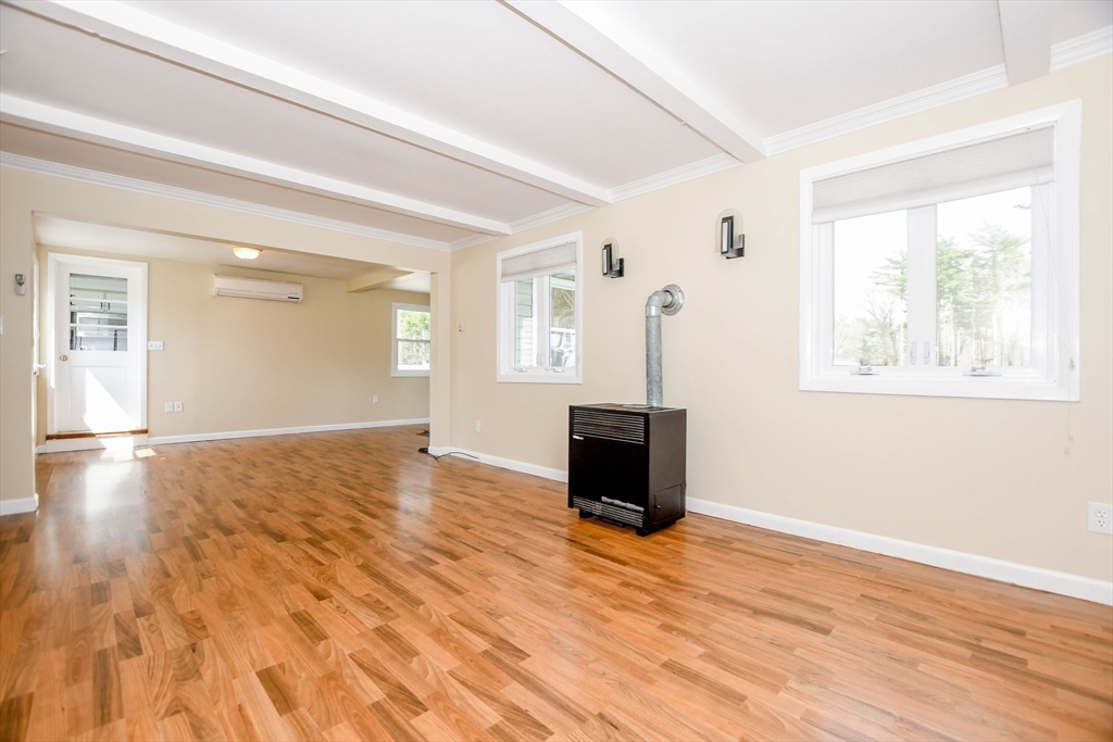 60 Mendell Road Rochester, MA 02770 - Photo 28 of 42 a view of an empty room with wooden floor and a window