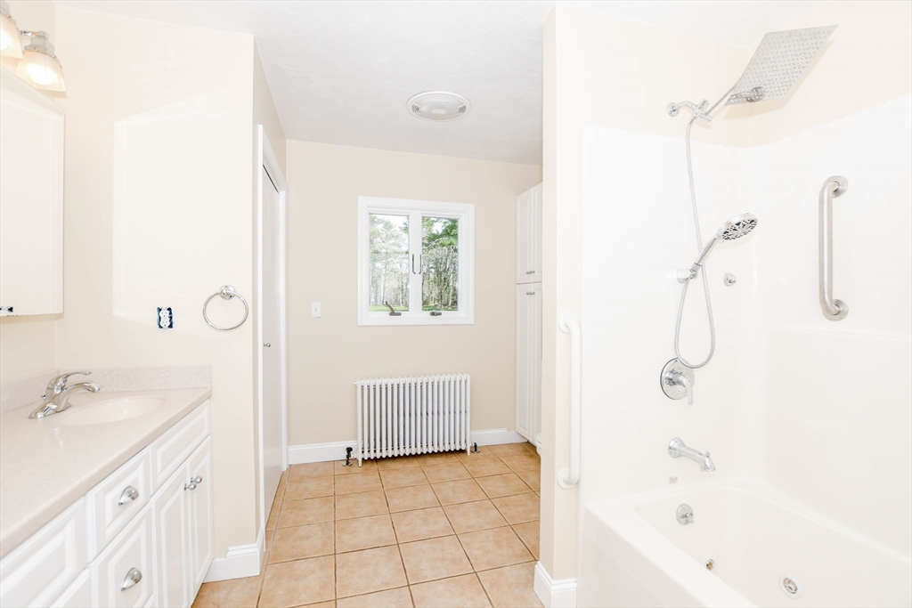 60 Mendell Road Rochester, MA 02770 - Photo 33 of 42 a bathroom with a sink a toilet and shower