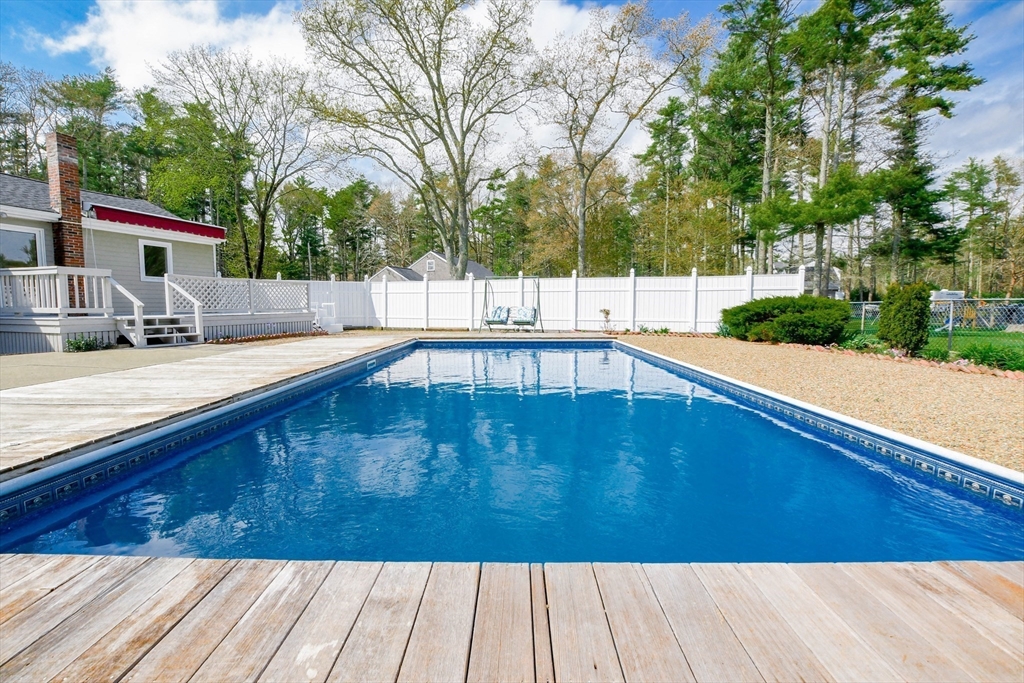60 Mendell Road Rochester, MA 02770 - Photo 9 of 42 a view of a swimming pool with a patio