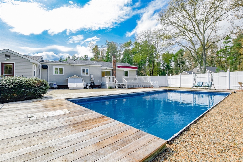 60 Mendell Road Rochester, MA 02770 - Photo 10 of 42 a view of a swimming pool with a patio