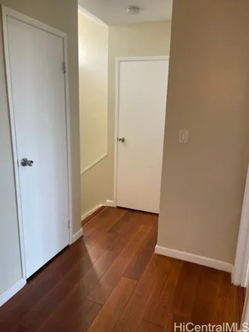 an empty room with wooden floor