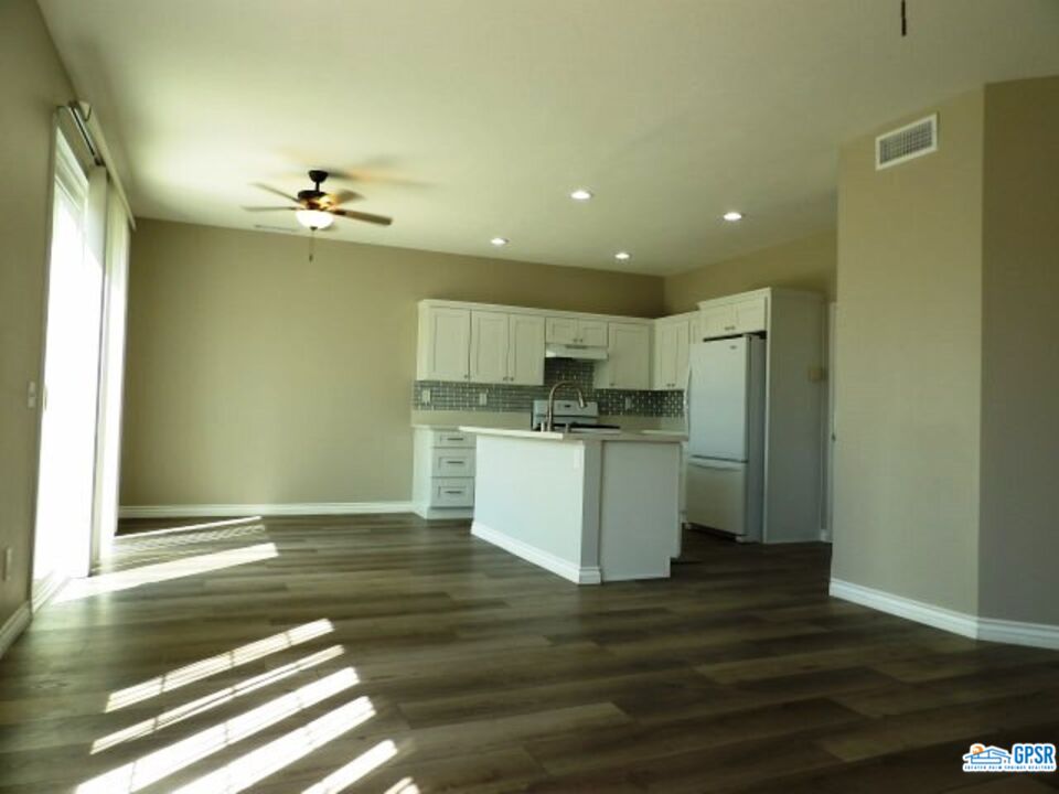 2703 Titania Place Simi Valley, CA 93063 - Photo 14 of 20 a view of kitchen with granite countertop cabinets and refrigerator