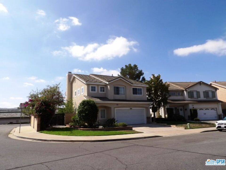 2703 Titania Place Simi Valley, CA 93063 - Photo 20 of 20 a front view of a house with a garden