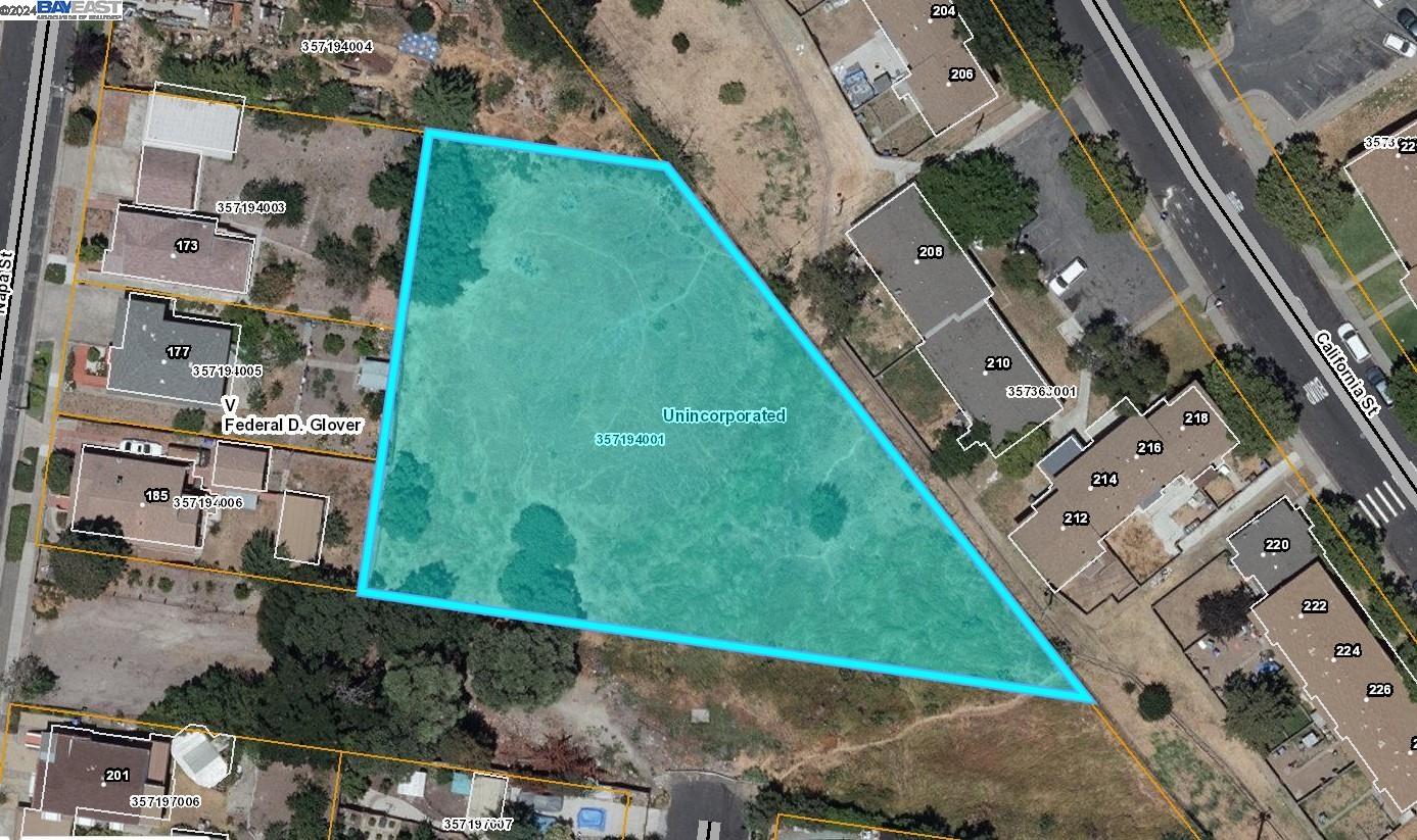 an aerial view of a residential houses with outdoor space