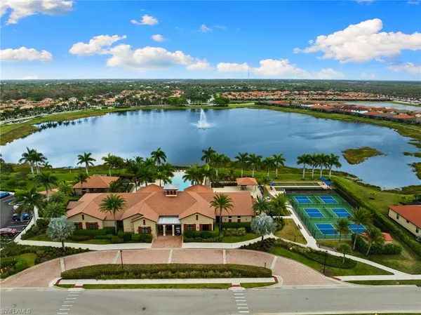 a view of a lake with outdoor seating