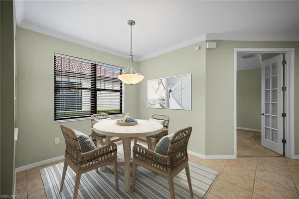 a view of a dining room with furniture window and outside view