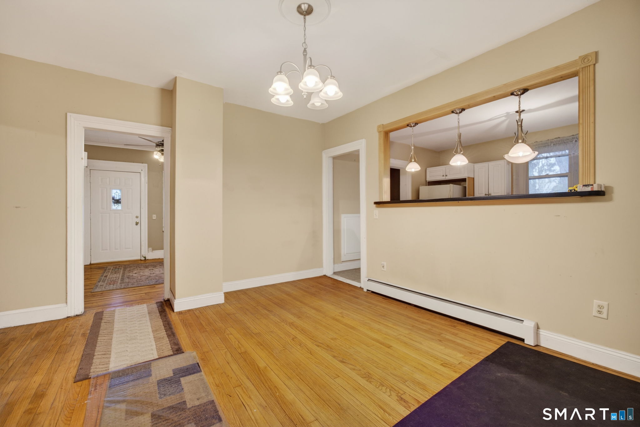 670 Hanover Road Meriden, CT 06451 - Photo 19 of 40 a big room with wooden floor and chandelier
