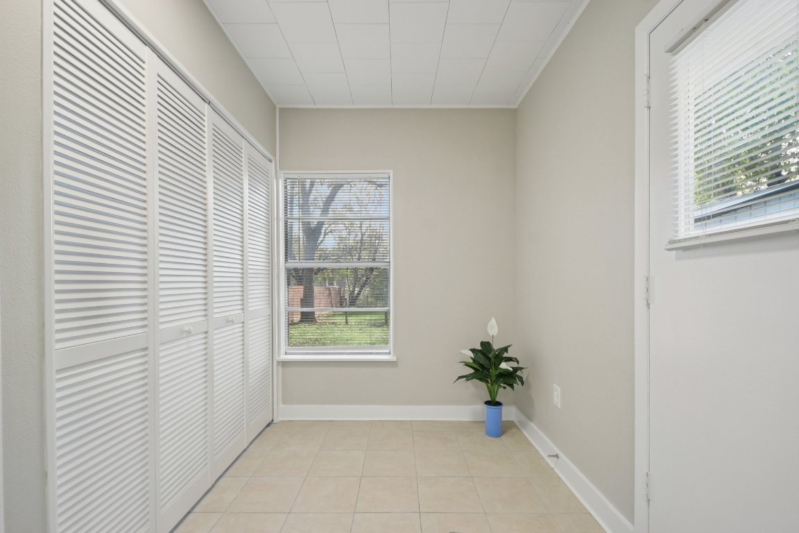209 East 8th Street Elgin, TX 78621 - Photo 12 of 23 a view of an empty room with a window