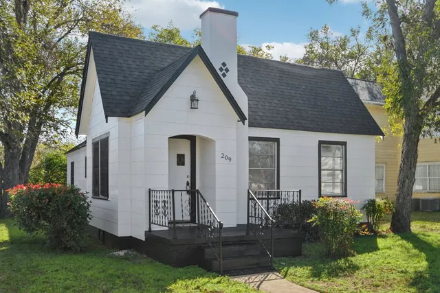 a front view of house with garden