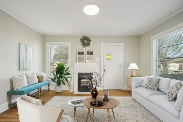 a living room with furniture and a fireplace
