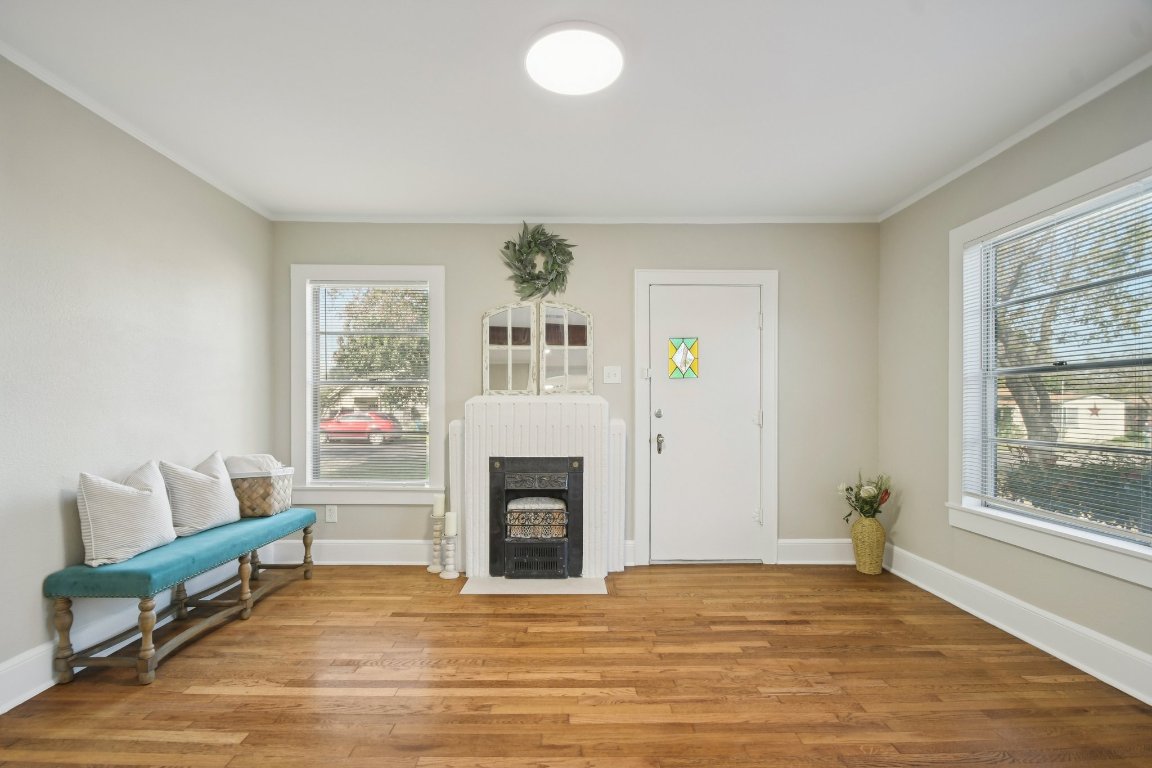 209 East 8th Street Elgin, TX 78621 - Photo 5 of 23 a view of livingroom with furniture and a fireplace