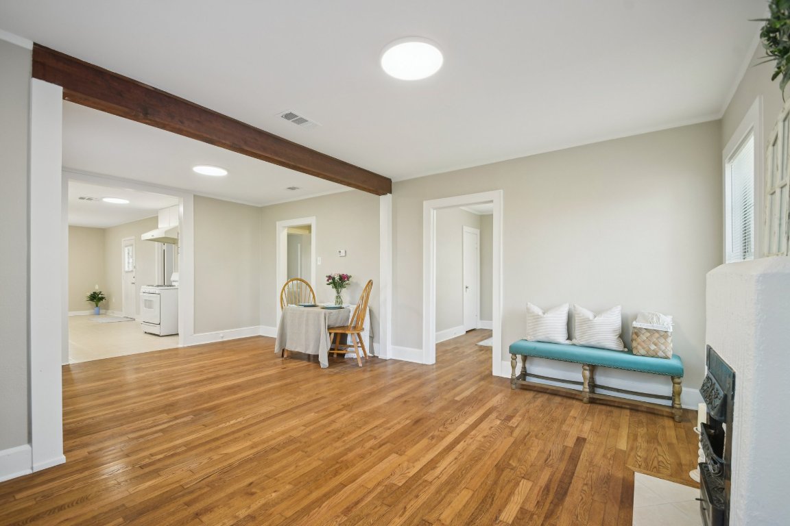 209 East 8th Street Elgin, TX 78621 - Photo 7 of 23 a view of a room with wooden floor and furniture