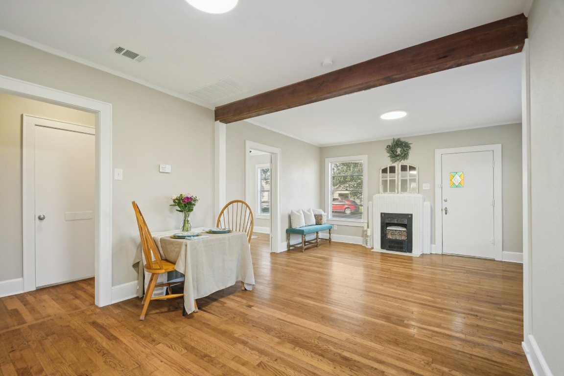 209 East 8th Street Elgin, TX 78621 - Photo 8 of 23 a living room with furniture a fireplace and a table