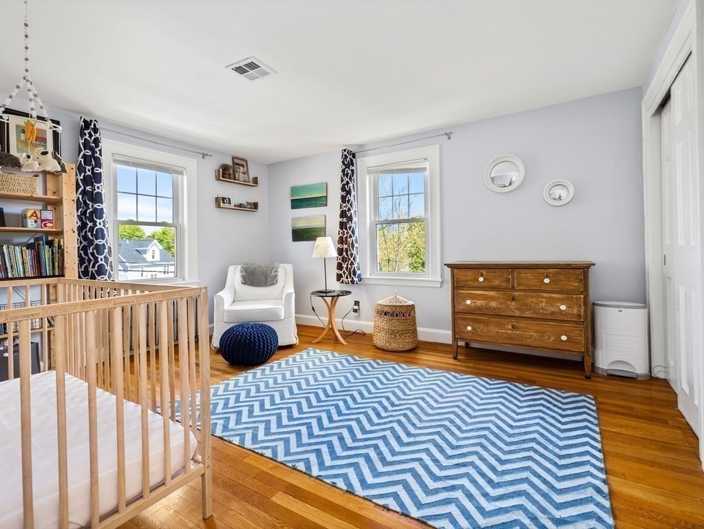 4 Malcolm Road Boston, MA 02130 - Photo 14 of 34 a bedroom with furniture and a window