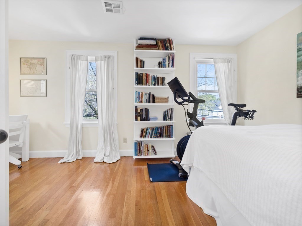4 Malcolm Road Boston, MA 02130 - Photo 15 of 34 a view of a bedroom with wooden floor and white walls
