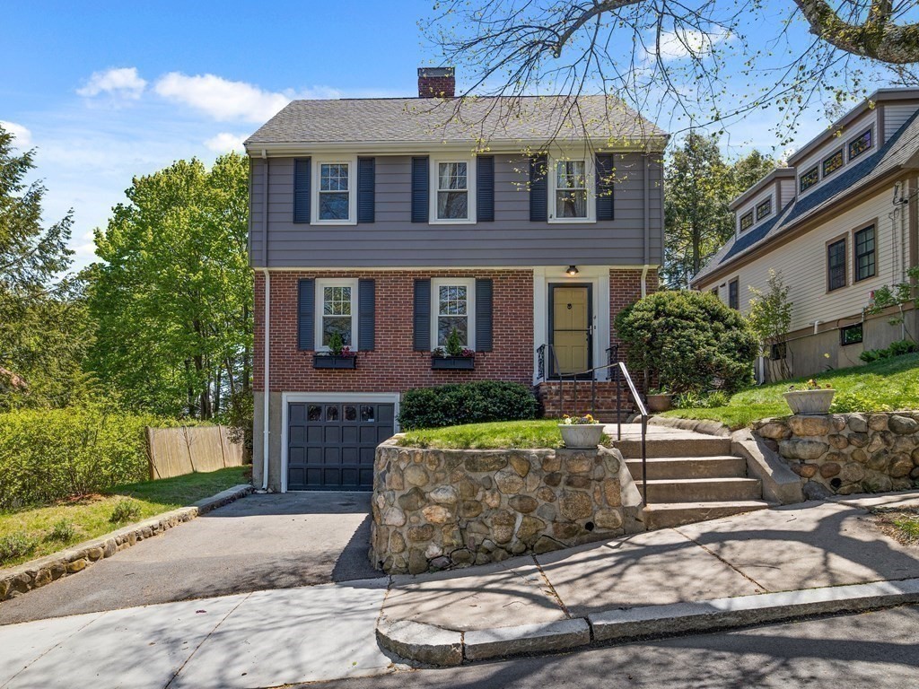 4 Malcolm Road Boston, MA 02130 - Photo 30 of 34 a front view of a house with garden
