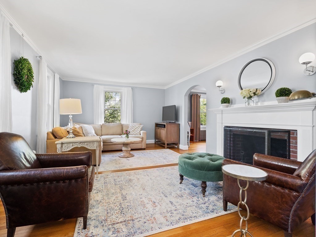 4 Malcolm Road Boston, MA 02130 - Photo 4 of 34 a living room with furniture and a fireplace