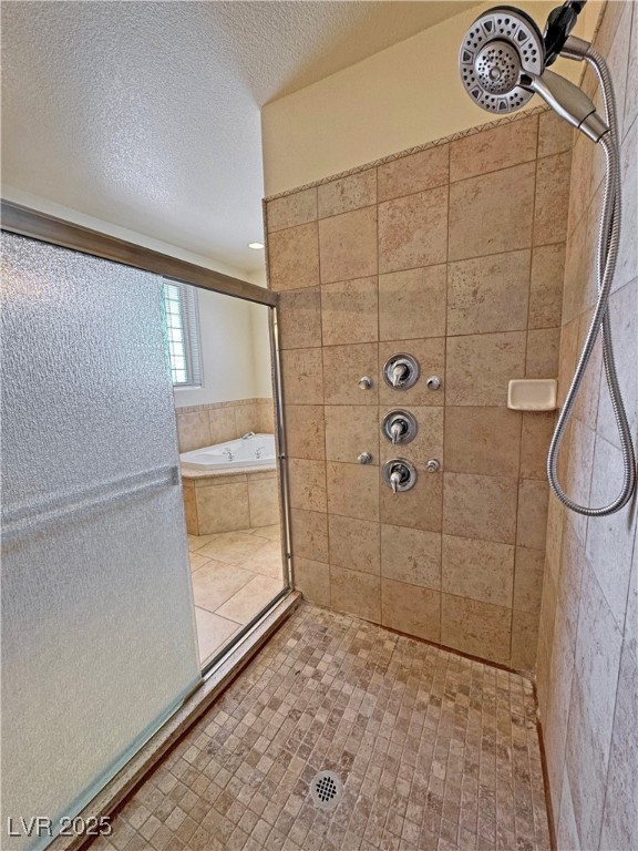 1771 Labrador Street Pahrump, NV 89048 - Photo 36 of 64 Full bath with a tile shower, a bath, and a textured ceiling