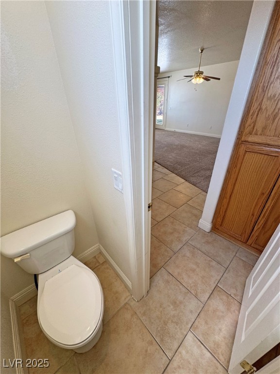 1771 Labrador Street Pahrump, NV 89048 - Photo 37 of 64 Bathroom featuring ceiling fan, a textured ceiling, and tile patterned flooring