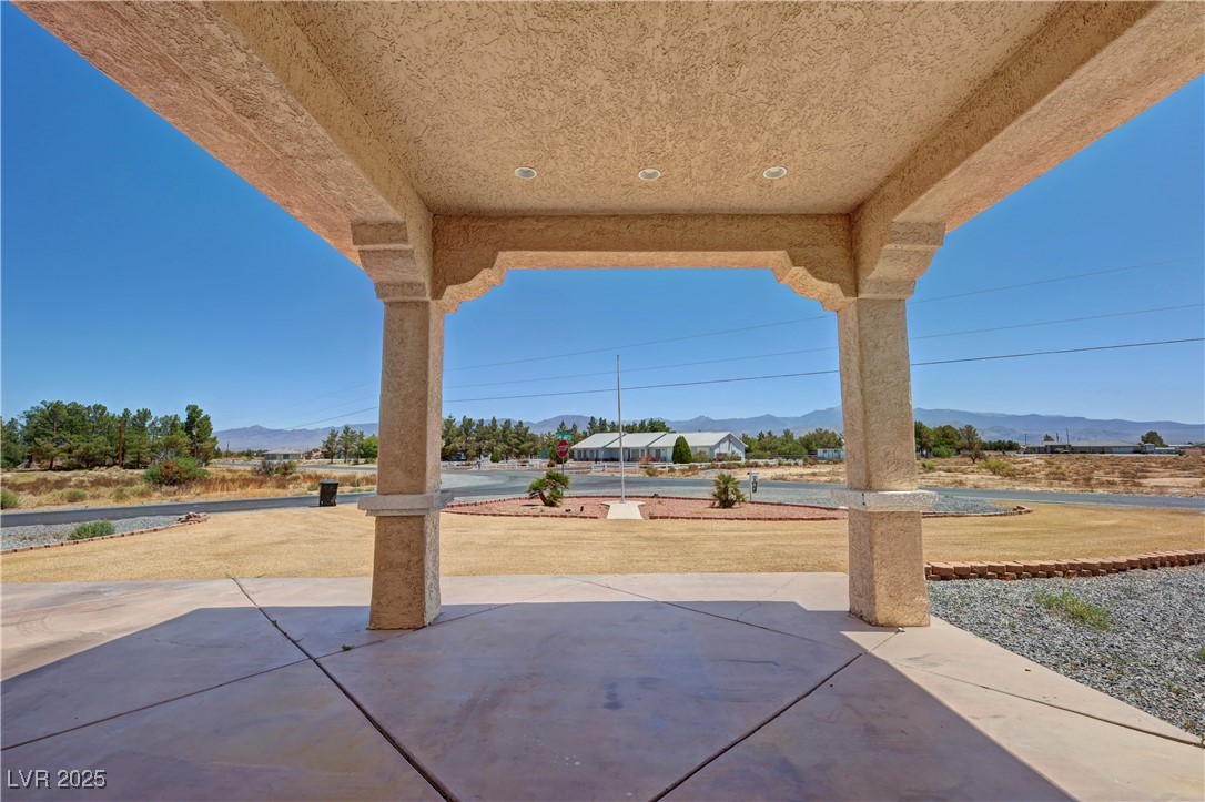 1771 Labrador Street Pahrump, NV 89048 - Photo 4 of 64 View of patio featuring a mountain view