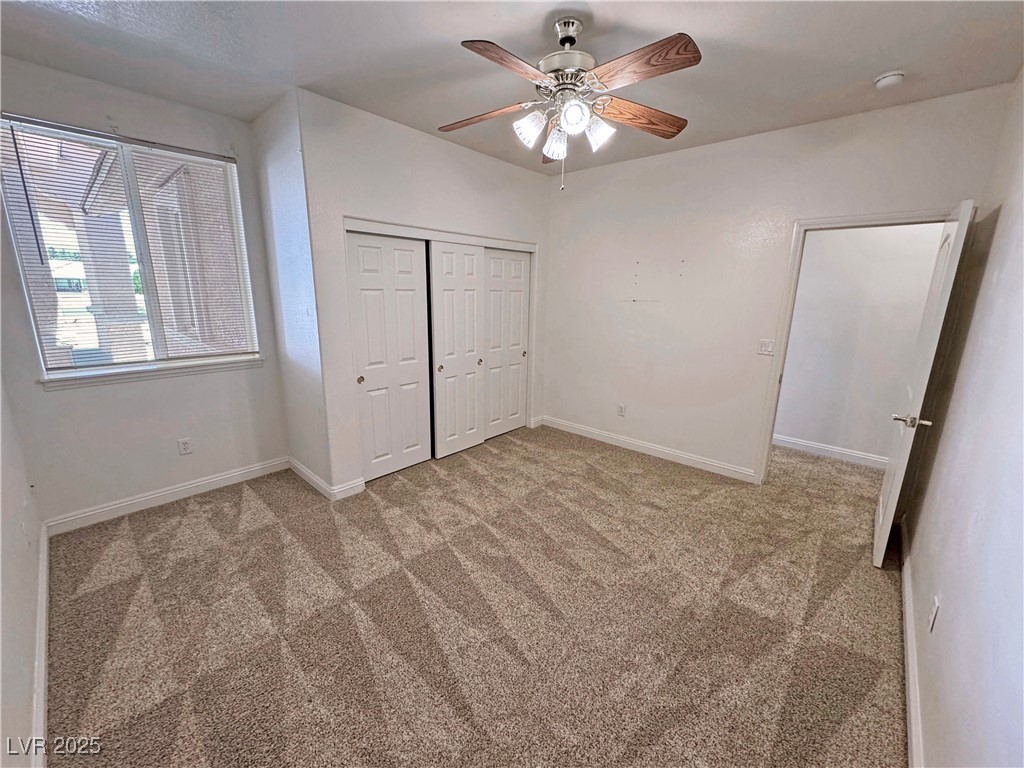1771 Labrador Street Pahrump, NV 89048 - Photo 39 of 64 Unfurnished bedroom with carpet, a closet, and a ceiling fan