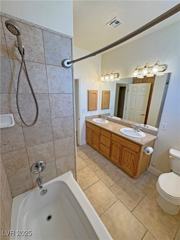 1771 Labrador Street Pahrump, NV 89048 - Photo 41 of 64 Full bath featuring shower combination, tile patterned floors, double vanity, and a textured ceiling