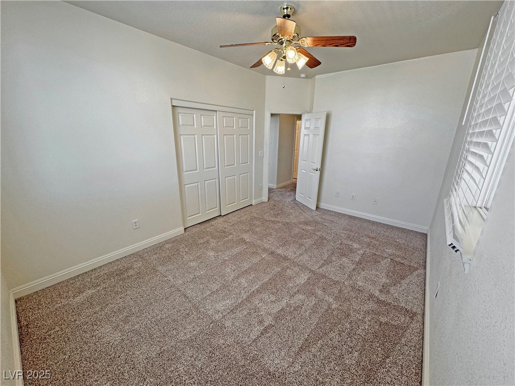1771 Labrador Street Pahrump, NV 89048 - Photo 43 of 64 Unfurnished bedroom with carpet, a closet, and ceiling fan