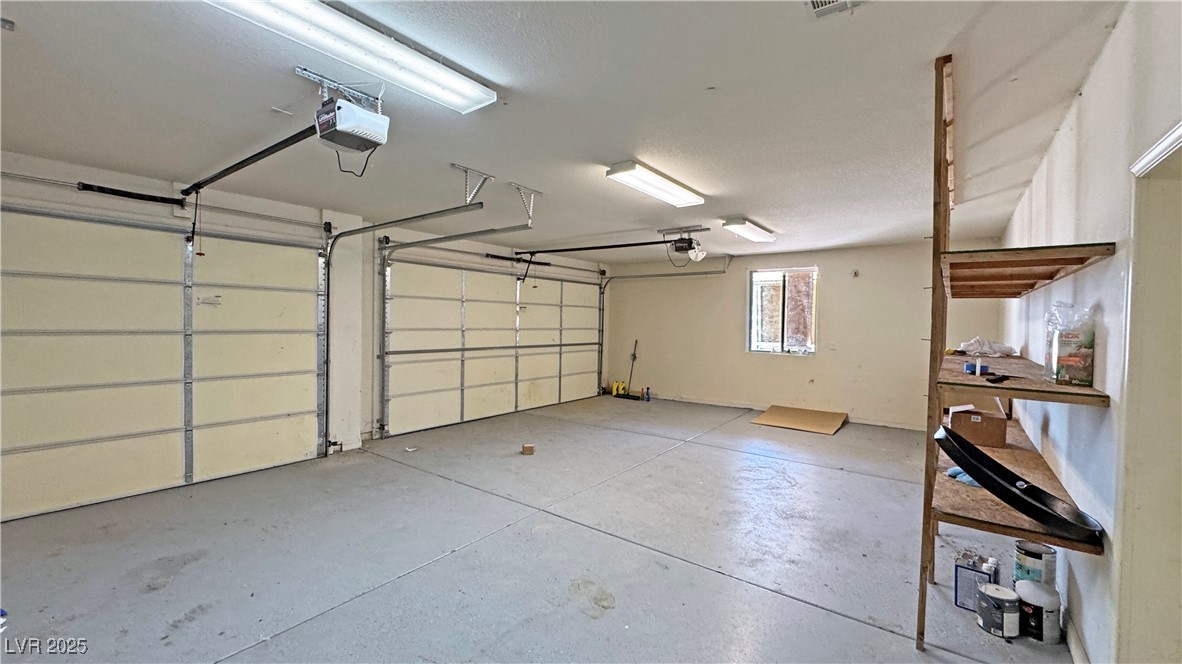 1771 Labrador Street Pahrump, NV 89048 - Photo 49 of 64 Garage with a garage door opener