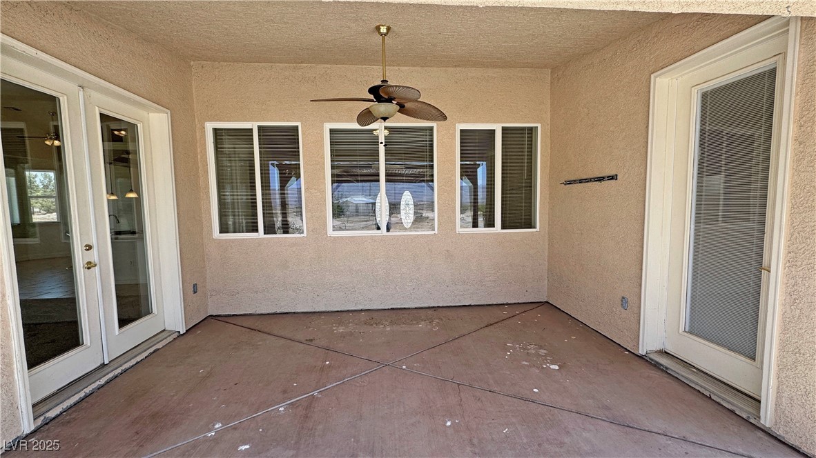 1771 Labrador Street Pahrump, NV 89048 - Photo 59 of 64 View of patio featuring a ceiling fan and french doors