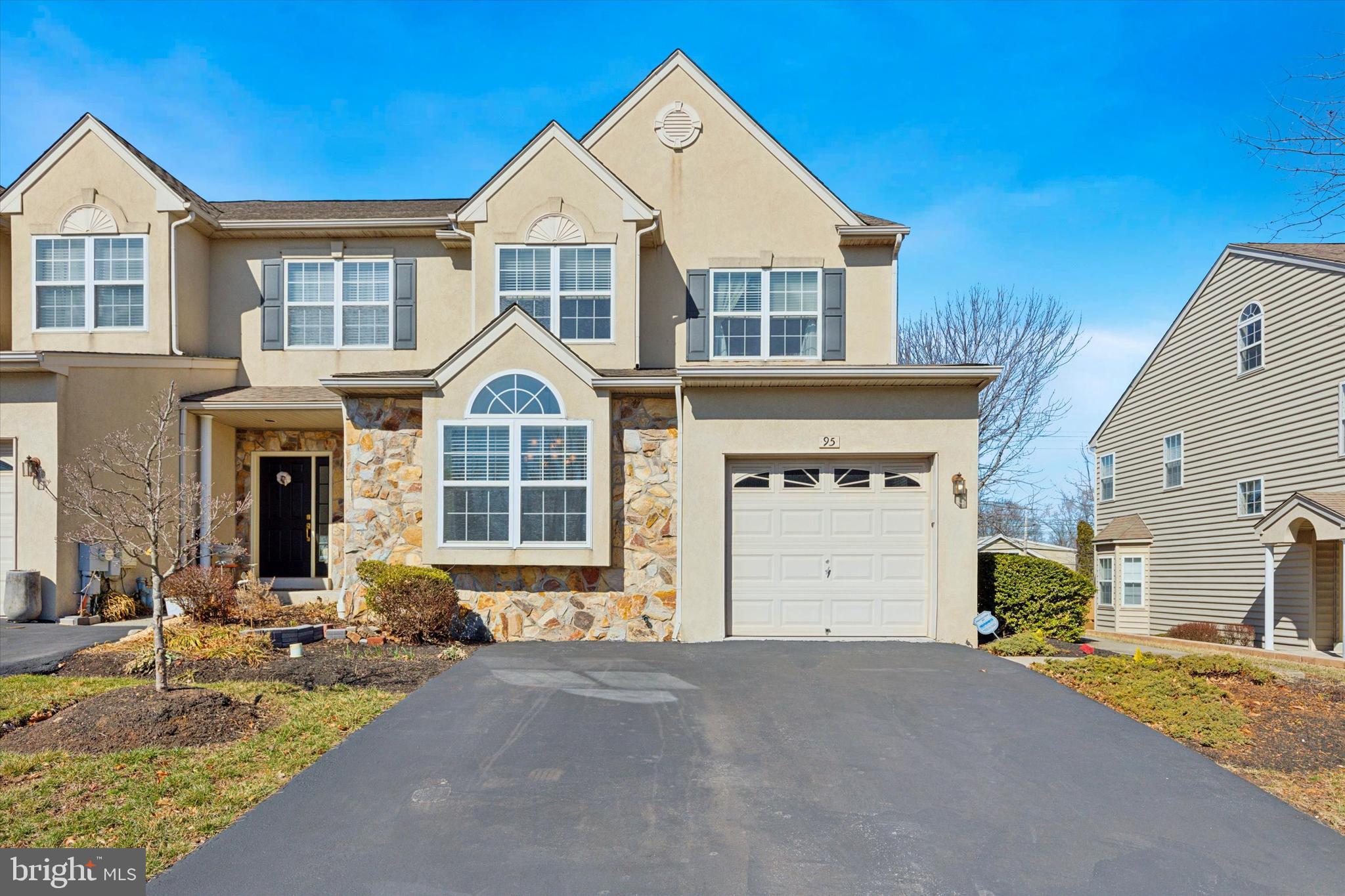 95 Arbor Circle Colmar, PA 18915 - Photo 1 of 26 a front view of a house with a yard and garage