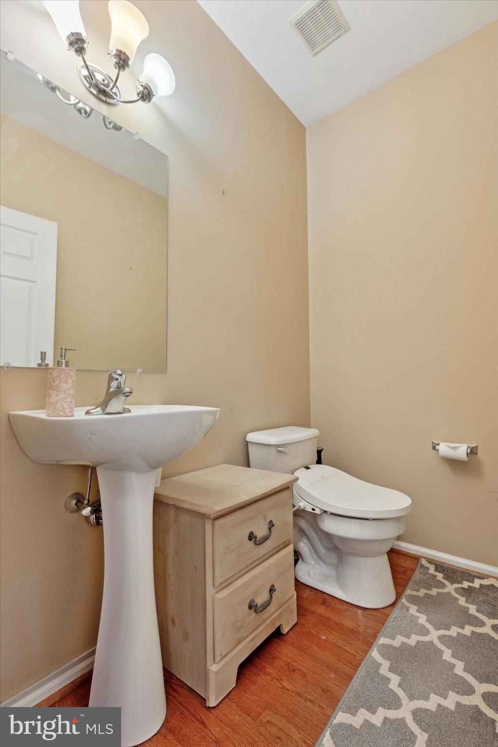 95 Arbor Circle Colmar, PA 18915 - Photo 13 of 26 a bathroom with a double vanity sink toilet and a mirror