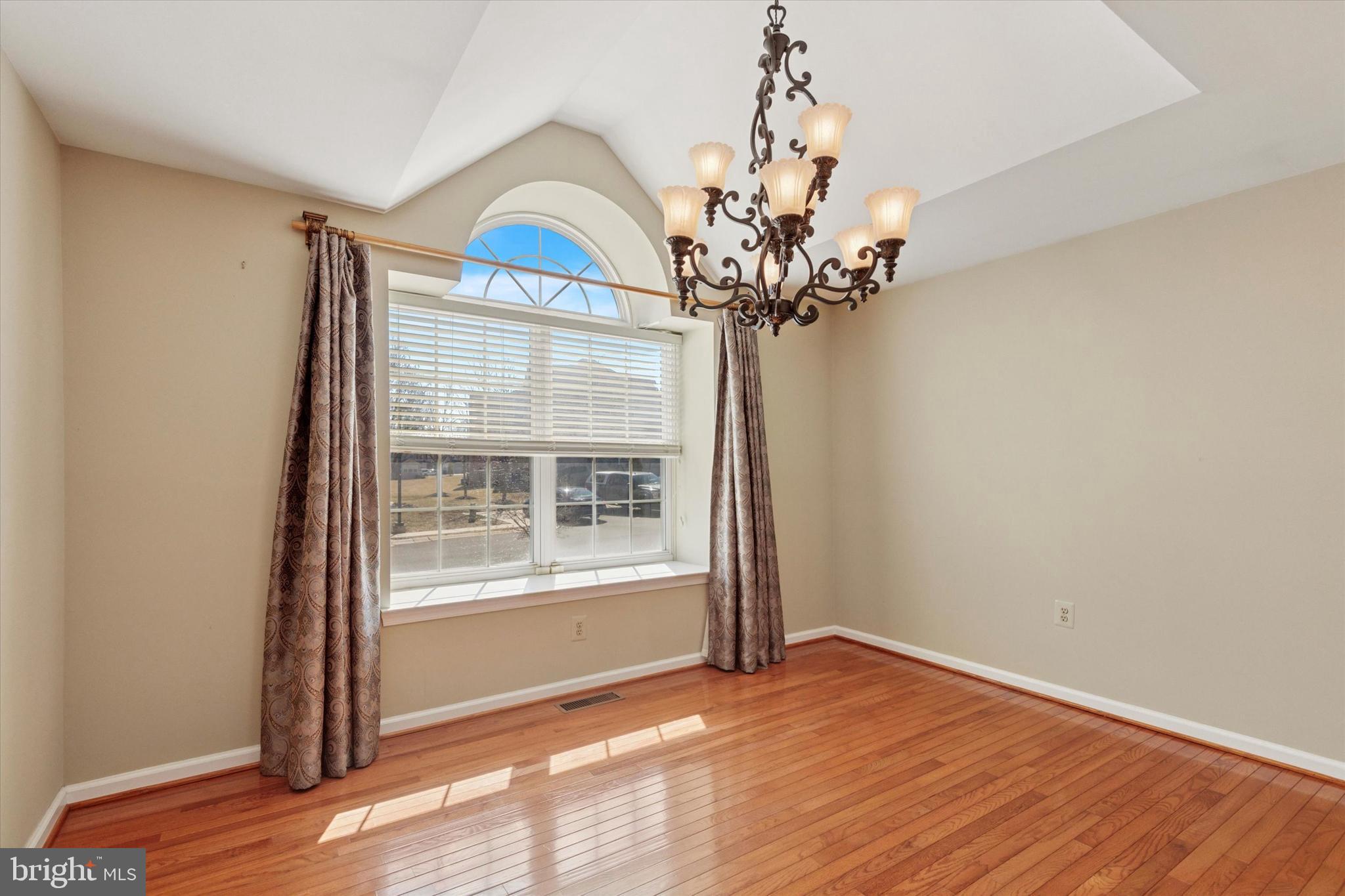 95 Arbor Circle Colmar, PA 18915 - Photo 14 of 26 a view of an empty room with wooden floor and a window