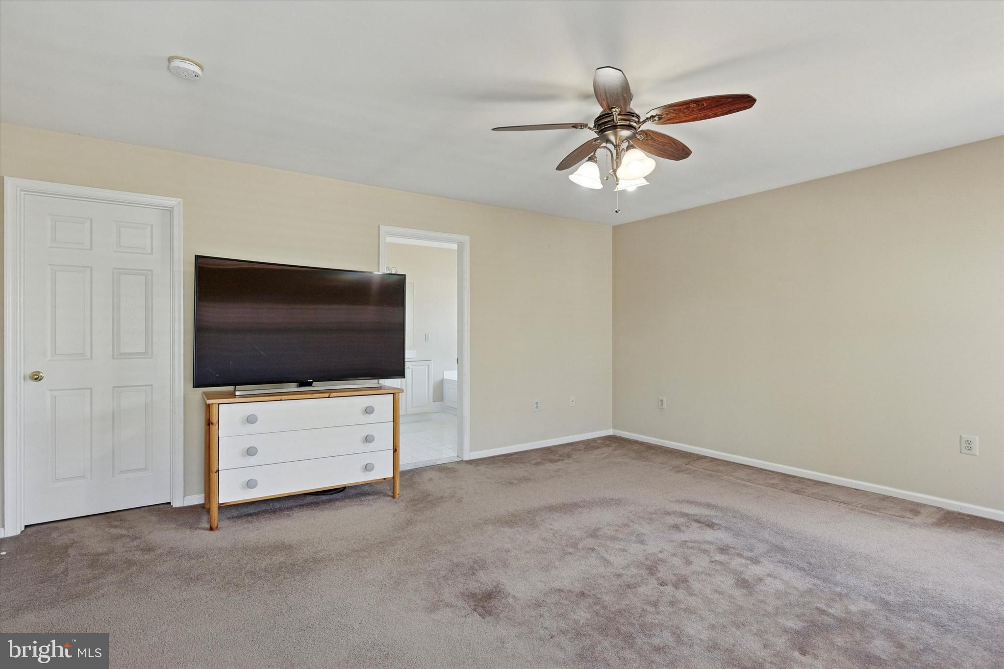 95 Arbor Circle Colmar, PA 18915 - Photo 16 of 26 a living room with flat screen tv and a ceiling fan