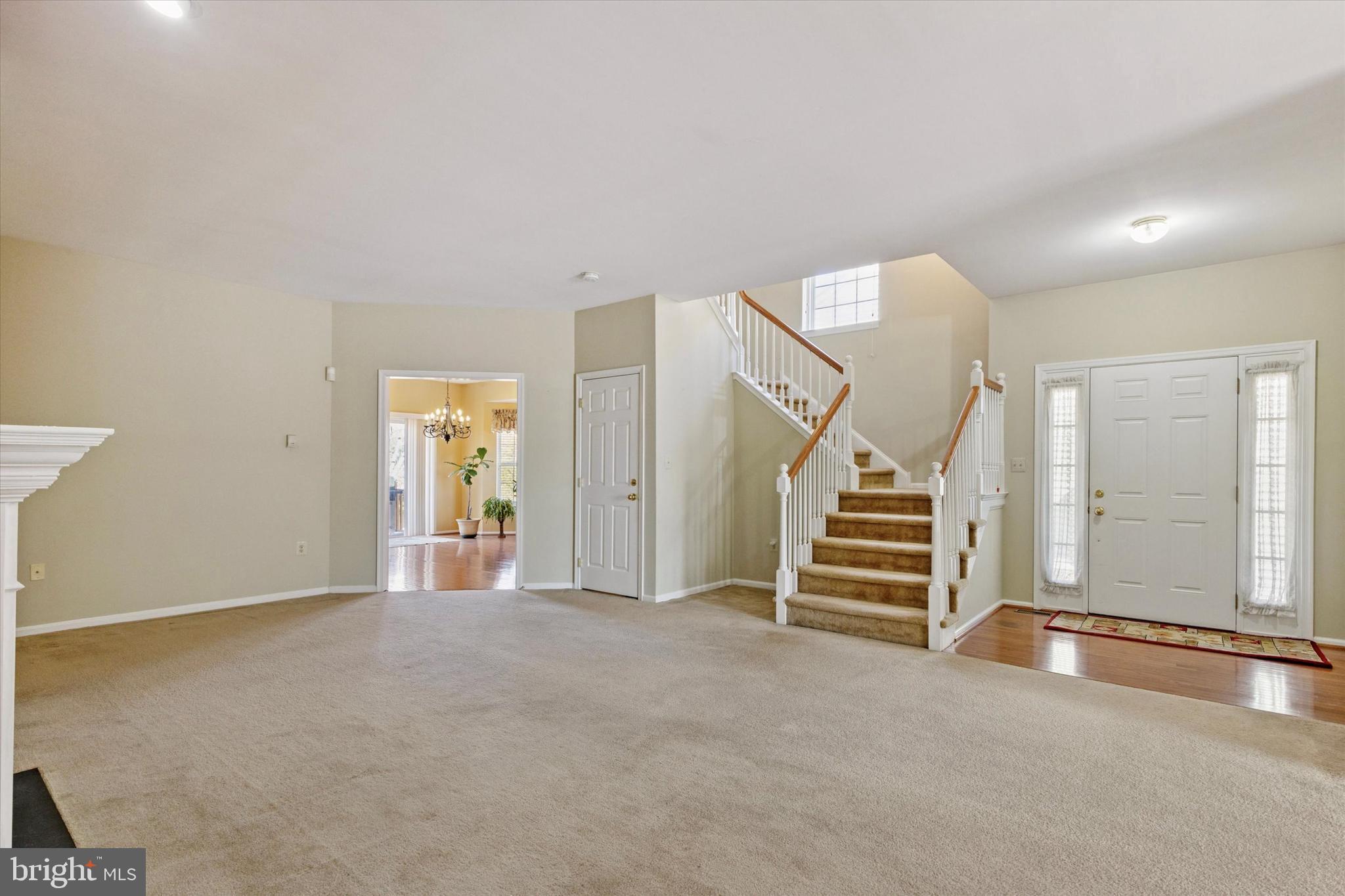 95 Arbor Circle Colmar, PA 18915 - Photo 7 of 26 an empty room with stairs and windows
