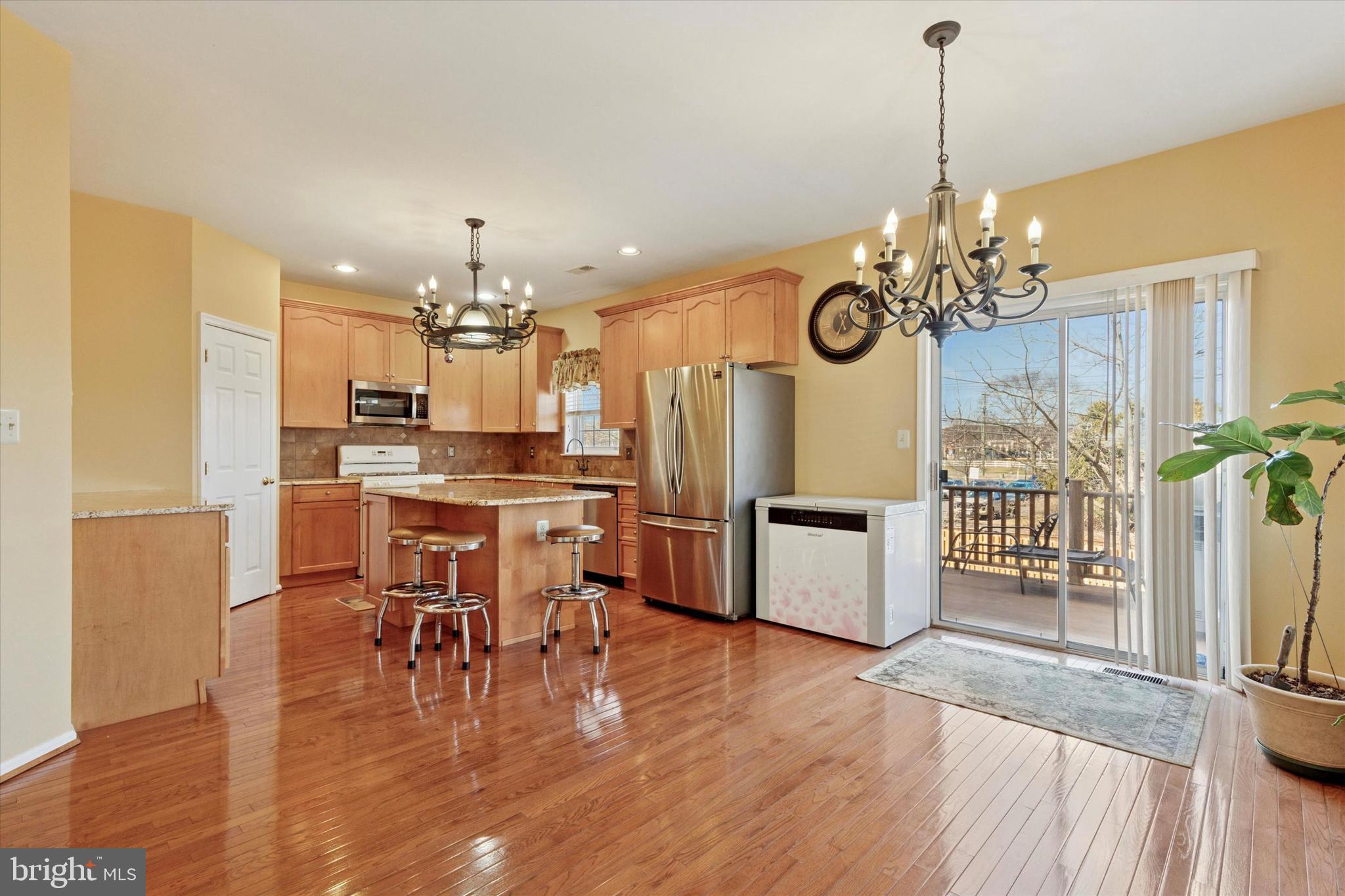 95 Arbor Circle Colmar, PA 18915 - Photo 8 of 26 a view of a dining room and livingroom with furniture wooden floor a chandelier