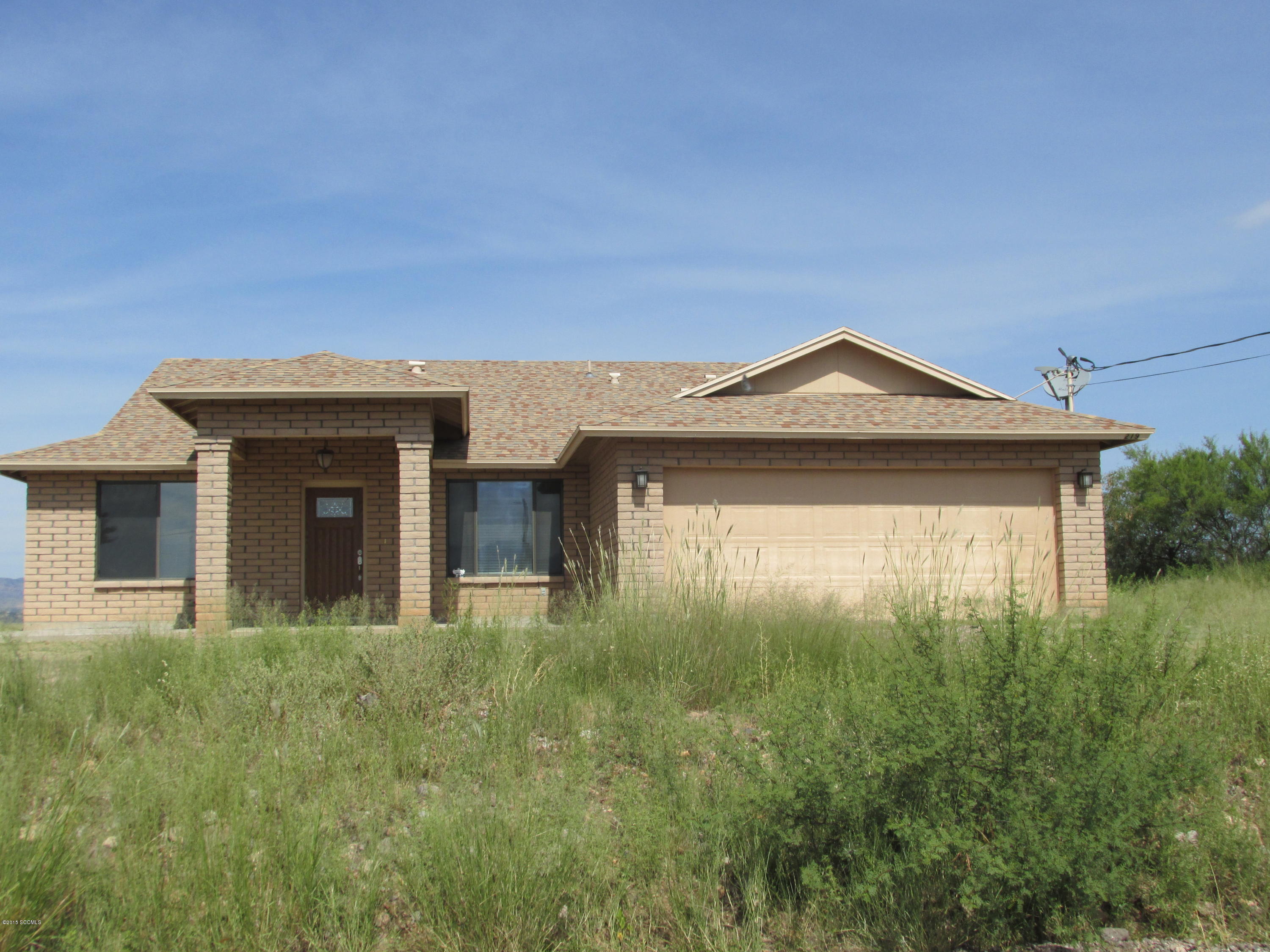 219 Paseo Mascota Rio Rico, AZ 85648 - Photo 2 of 7 a front view of a house with a yard