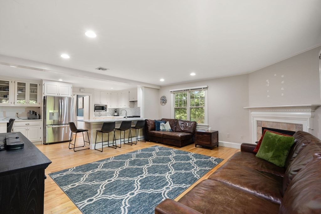 61 Silver Hill Road Weston, MA 02493 - Photo 12 of 39 a living room with furniture and a fireplace
