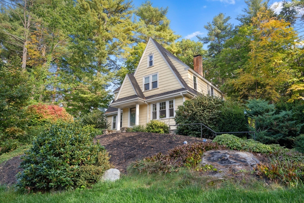 61 Silver Hill Road Weston, MA 02493 - Photo 2 of 39 a front view of a house with a garden