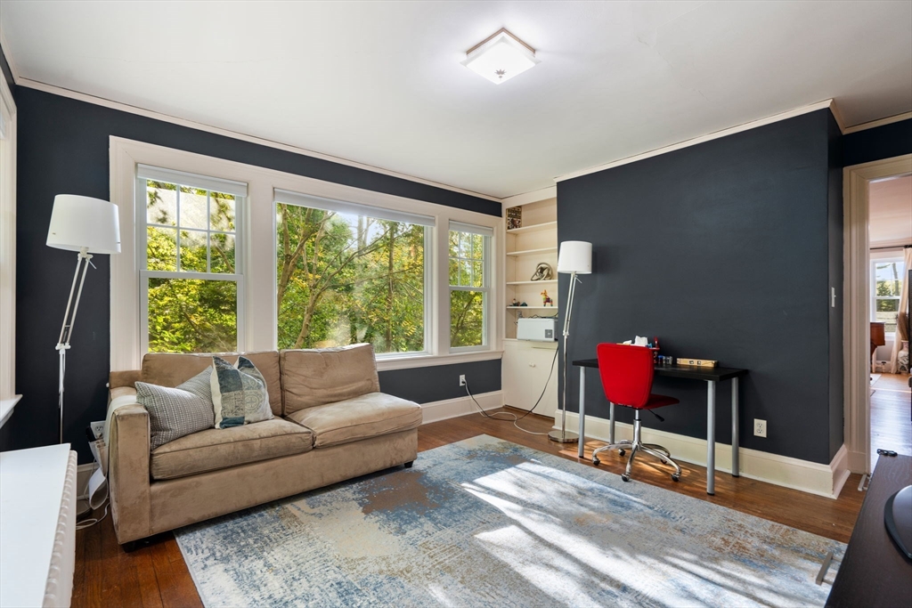 61 Silver Hill Road Weston, MA 02493 - Photo 23 of 39 a living room with furniture and a floor to ceiling window