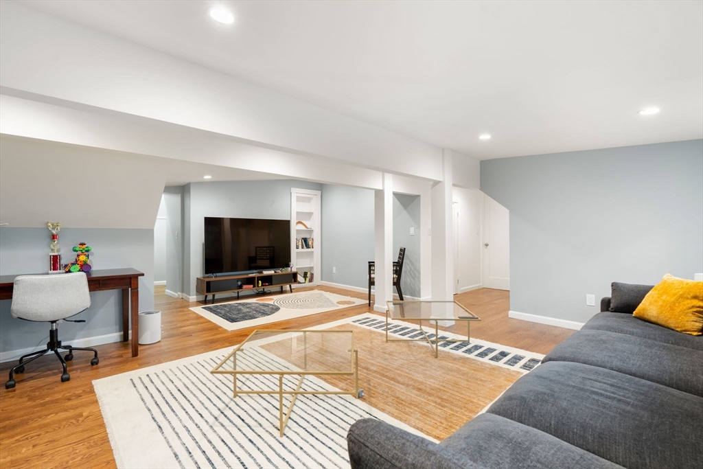 61 Silver Hill Road Weston, MA 02493 - Photo 25 of 39 a bedroom with a bed and a flat screen tv