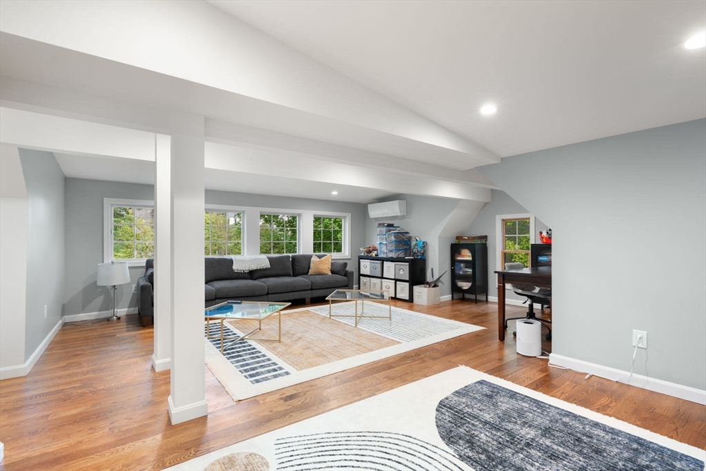 61 Silver Hill Road Weston, MA 02493 - Photo 26 of 39 a living room with furniture and a wooden floor