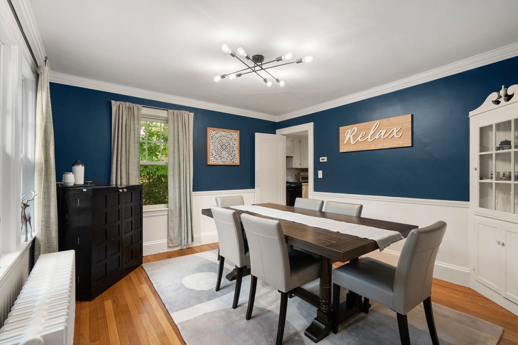 61 Silver Hill Road Weston, MA 02493 - Photo 7 of 39 a view of a dining room with furniture and a chandelier