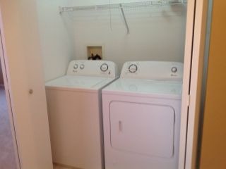 3144 Falling Waters Lane, Unit 3142 Lindenhurst, IL 60046 - Photo 11 of 16 a utility room with dryer and washer