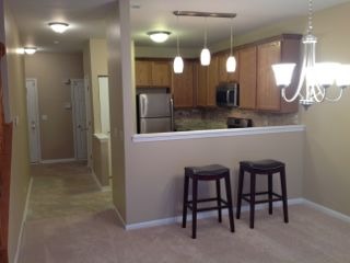 3144 Falling Waters Lane, Unit 3142 Lindenhurst, IL 60046 - Photo 3 of 16 a kitchen with a sink cabinets and stainless steel appliances