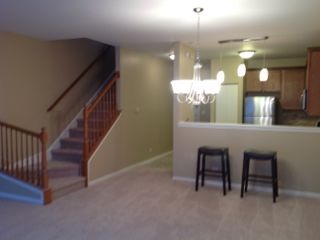 3144 Falling Waters Lane, Unit 3142 Lindenhurst, IL 60046 - Photo 4 of 16 a view of a dining room with furniture