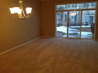 3144 Falling Waters Lane, Unit 3142 Lindenhurst, IL 60046 - Photo 7 of 16 a view of empty room with wooden floor
