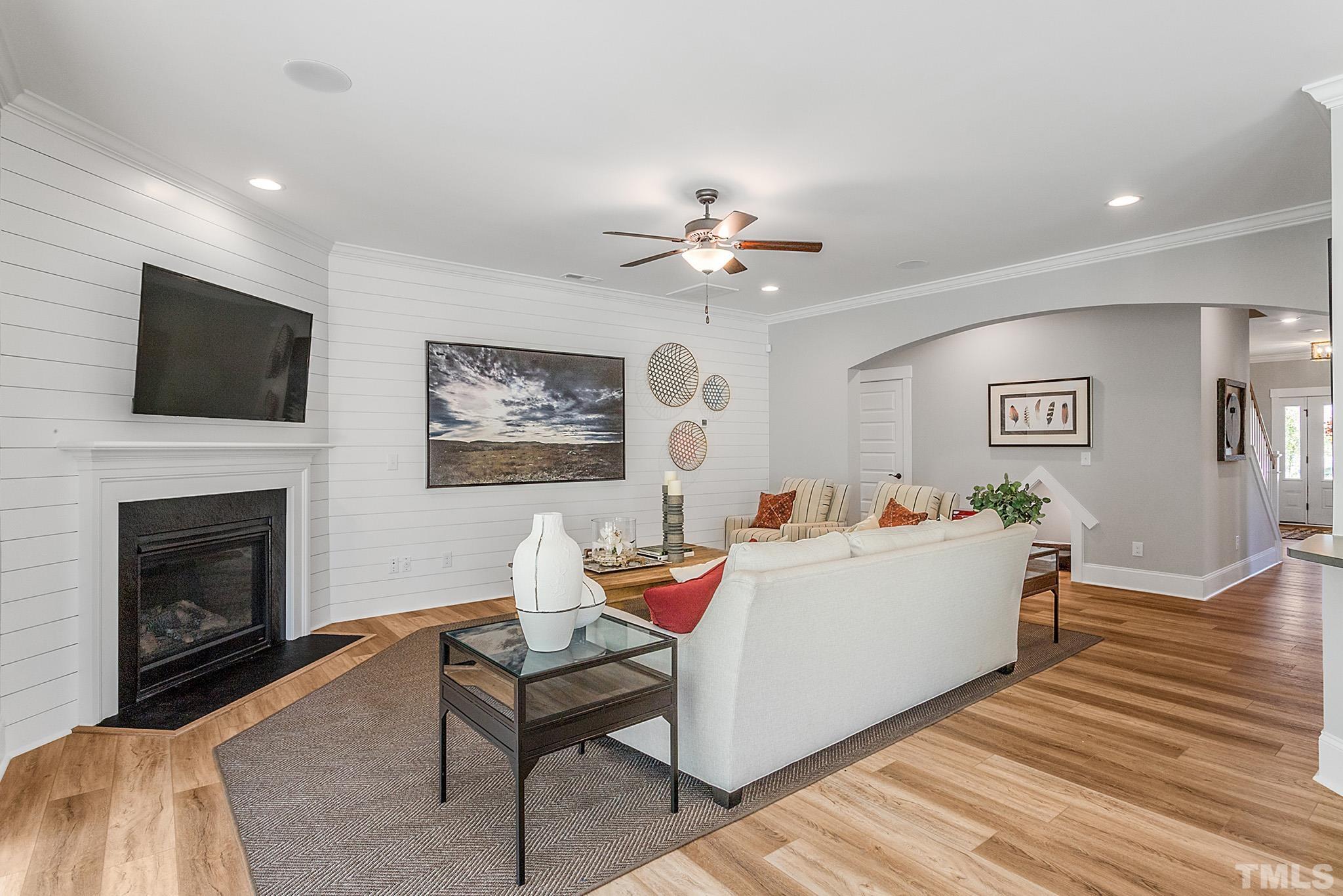 243 Oak Branch Trail Garner, NC 27529 - Photo 15 of 29 a living room with furniture and a fireplace