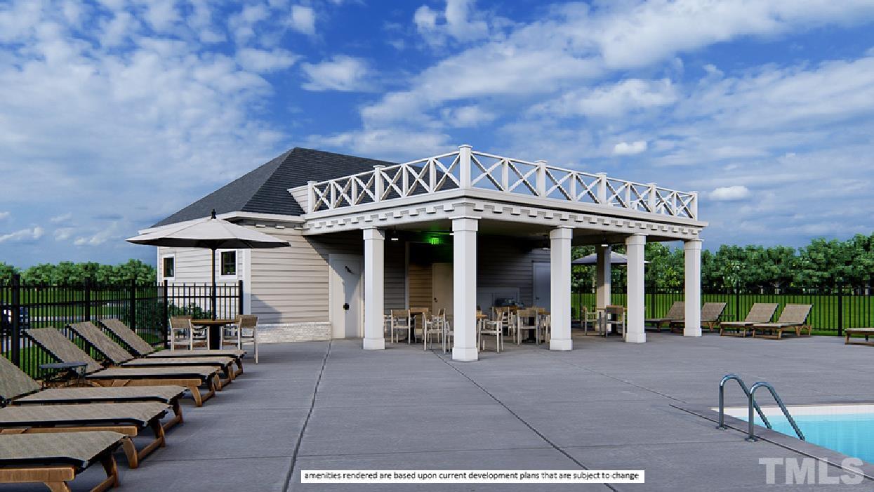 243 Oak Branch Trail Garner, NC 27529 - Photo 27 of 29 a front view of a building with glass windows and bench