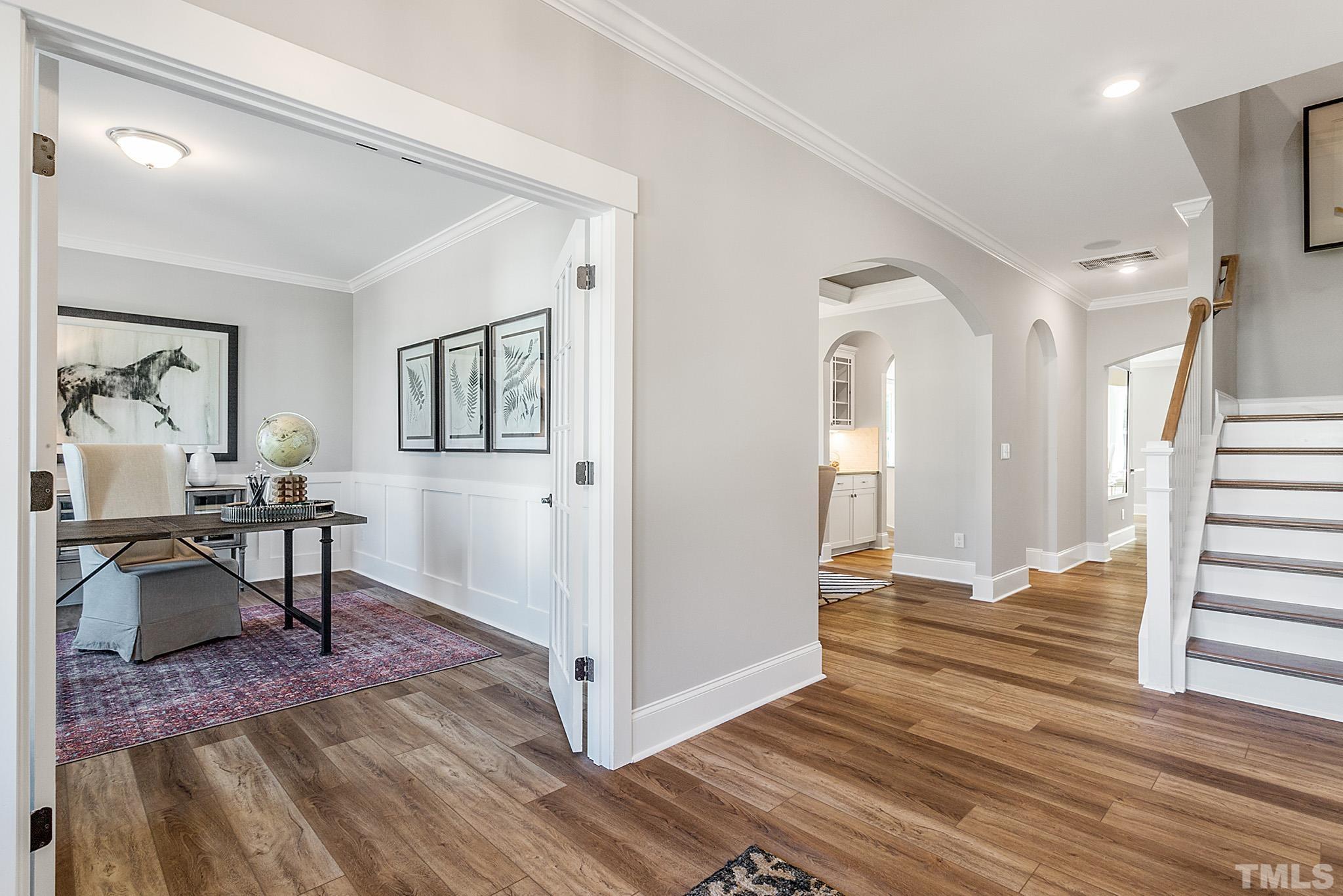 243 Oak Branch Trail Garner, NC 27529 - Photo 5 of 29 a view of a livingroom with furniture and wooden floor
